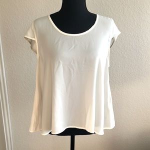 Cream Elodie Blouse. A bit translucent. Teen size.